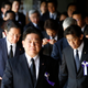 A group of lawmakers walk after offering prayers at the Yasukuni Shrine in Tokyo August 15, 2014, to mark the 69th anniversary of Japan's surrender in World War Two. Japanese Prime Minister Shinzo Abe on Friday sent a ritual offering to a Tokyo shrine to war dead but did not join cabinet ministers in a visit, seen as an effort to avoid further inflaming ties with China as he seeks a summit with Beijing. REUTERS/Yuya Shino